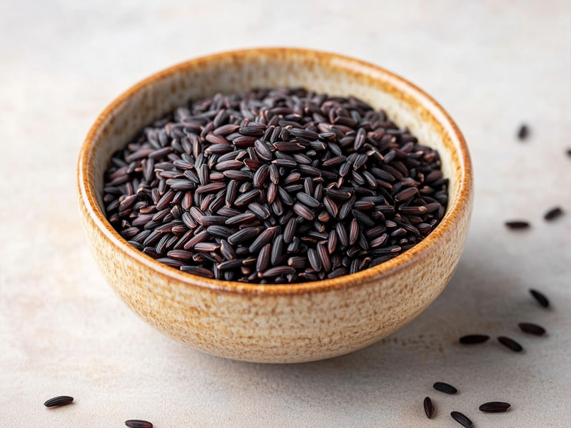 Exotic organic black rice in a light ceramic bowl