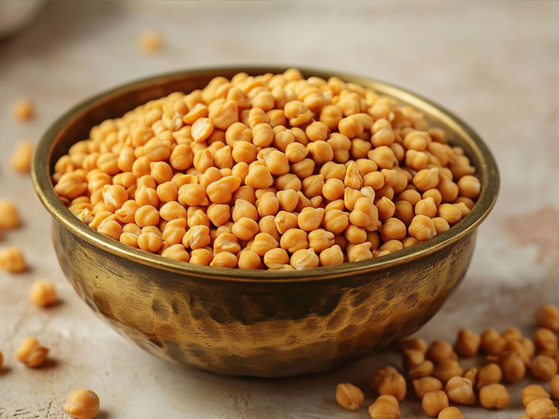 Organic chana dal in a brass bowl