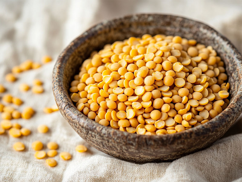 Organic toor dal in a rustic stone bowl