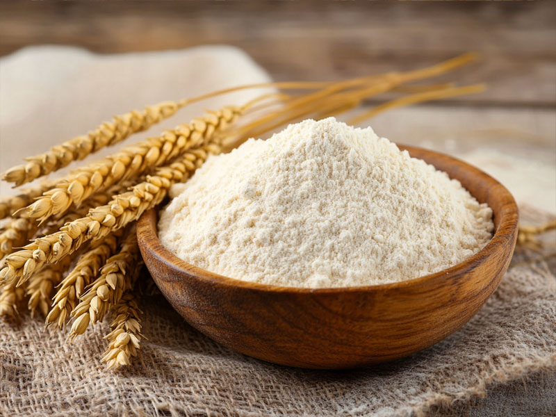 Fresh organic whole wheat atta with wheat stalks